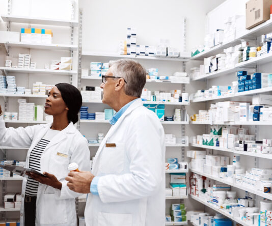 Pharmacists looking at healthcare labels