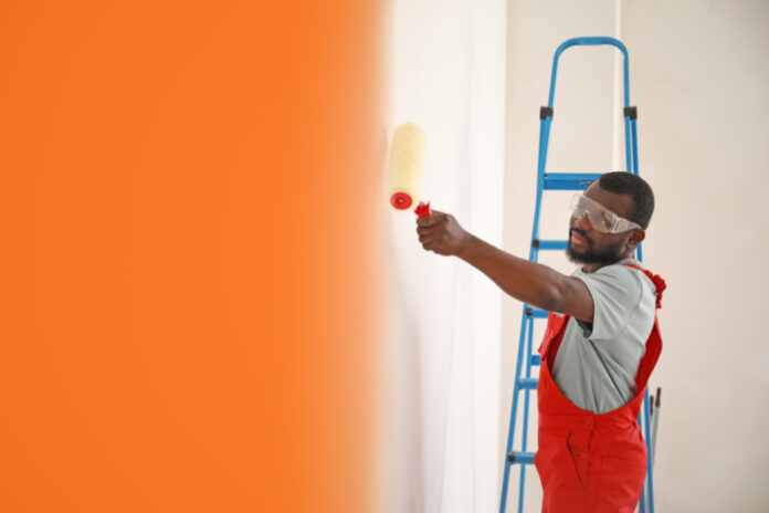Business Person painting a wall