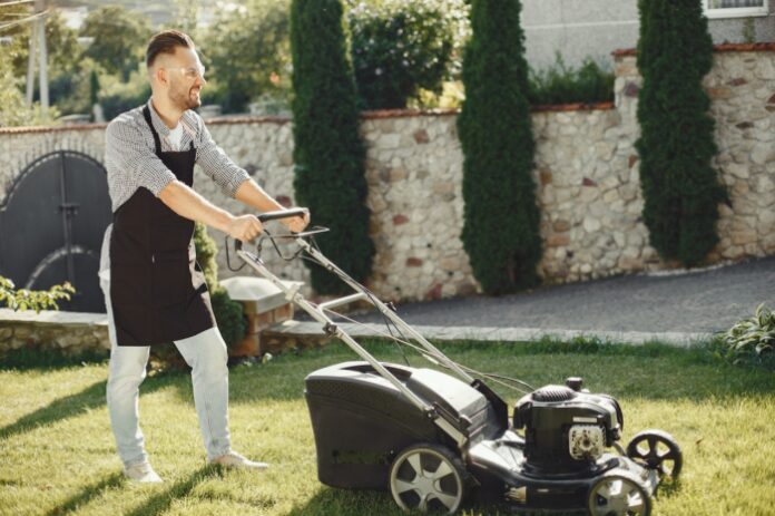 Business Person mowing a lawn