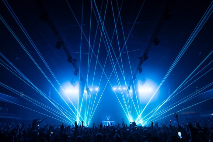 The crowd delights at the crisp lasers and dynamic floor-to-ceiling lights that danced around The Armory in Minneapolis. 