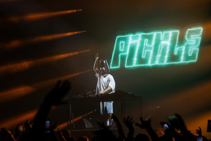DJ Pickle dons a distinctive mask that complements his name as he performs as the opening act for Steve Aoki at The Armory in Minneapolis.