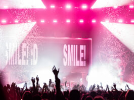 The crowd get's a positive reminder from Porter Robinson's latest album title. Photo credit: Brez Media