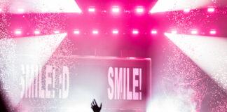 The crowd get's a positive reminder from Porter Robinson's latest album title. Photo credit: Brez Media