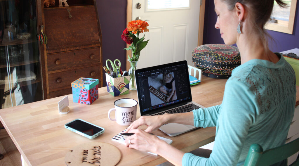 Woman seated at her desk in home office, Smiling Tree Toys and Smiling Tree Gifts