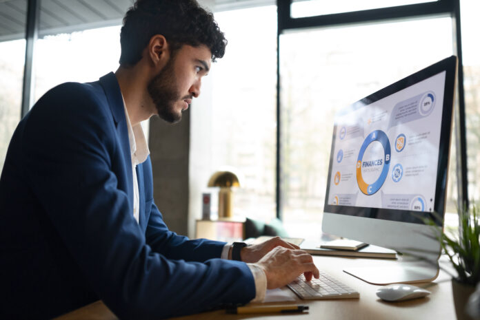 person-office-analyzing-checking-finance-graphs