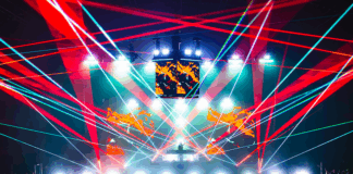 EDM music venue filled with lights, lasers, and visuals during post-holiday show.