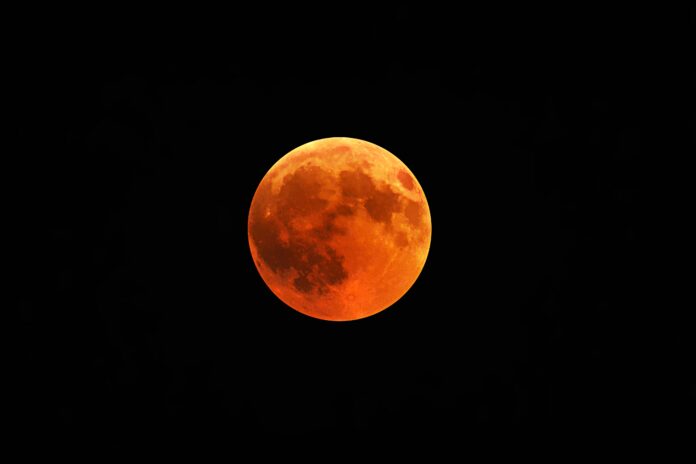 Beautiful shot of a red moon, total lunar eclipse with a black night sky in the background Is-Tonight-a-Blood- Moon