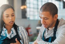 Hidden Costs That Hurt Small Food Startups Two restaurant founders sit at a table and calculate the money needed to keep their business running.
