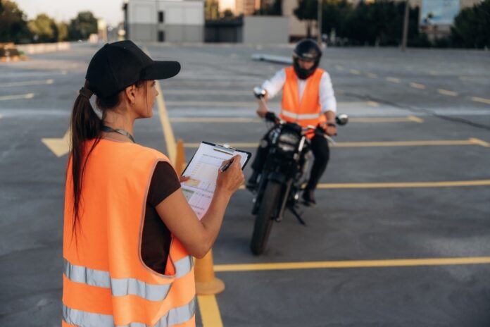 woman-instructor-observing-motorbike-rider-in-park-2026-03-26-03-21-33-utc Comprehensive Two-Wheeler Insurance vs Third Party