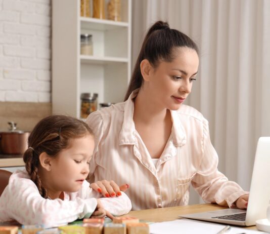 Work-from-home parent with au pair caring for children